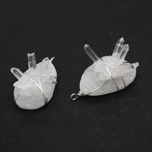Detailed view of handmade natural white crystal pendants with wire wrapped stones