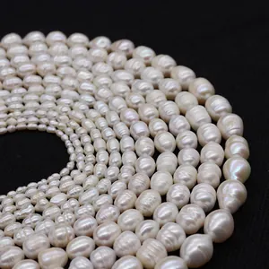 Macro shot of tiered natural freshwater pearls in ivory white on black background