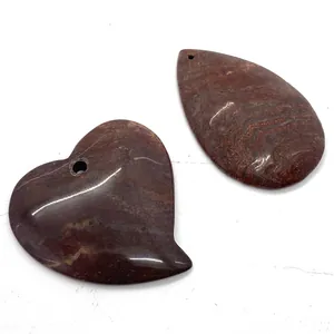 Polished natural agate stone pendants in heart and teardrop shapes with red-brown veins