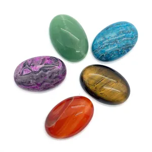Set of five polished oval gemstone cabochons including Tiger Eye and Red Agate stones