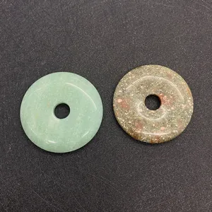 Detail of 50mm green aventurine and spotted stone flat round pendant charms