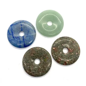 Set of four 50mm natural stone Pi Disc pendants including green and blue aventurine stones