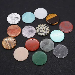 Macro detail of various 30mm round natural stone flat disc pendants with pre-drilled holes