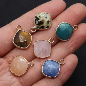 Set of six natural tiger eye and rose quartz square pendants with gold plating shown on hand