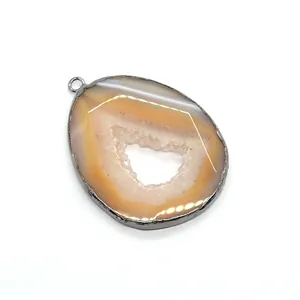 Natural druzy agate teardrop pendant with amber stone texture and metallic border edge