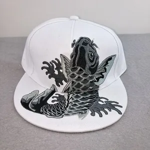 Detail of high-quality koi fish embroidery on a white flat-brimmed hip-hop baseball cap