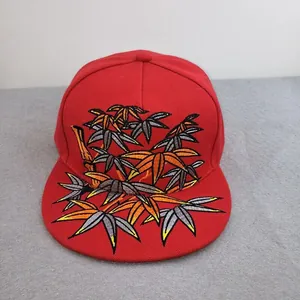Red flat brim baseball cap with detailed bamboo leaf embroidery and six-panel construction