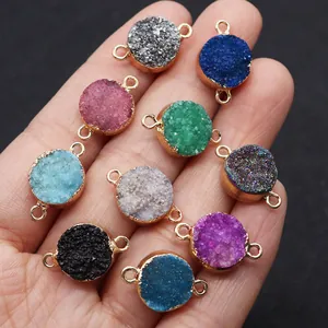 Detailed macro of 12x18mm colorful round druzy stone connectors with gold edges