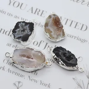 Macro view of silver-plated druzy agate pendants and double-loop stone connectors