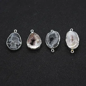 Macro view of four natural agate druzy pendants with silver electroplated edges