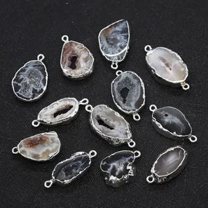 Detail of natural agate druzy stone connectors with silver edges for DIY jewelry making