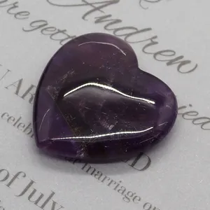 Macro detail of polished heart-shaped natural amethyst stone with unique internal textures