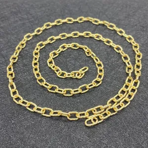 Golden twist oval link chain roll for DIY jewelry making with spiral texture finish