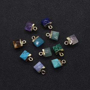 Close-up of square cut natural stone pendants with gold metal bail for DIY necklaces