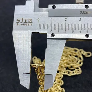 Detail view of 10mm golden twist chain link width measurement with a caliper tool