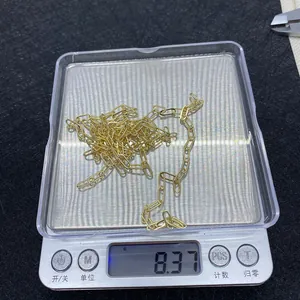 Detailed weight measurement showing 8.37g for gold oval paperclip link chain accessory