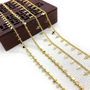 Golden metal twist chain necklaces set with round sequins and minimalist cross pendants