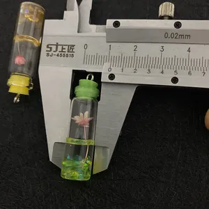 Detailed measurement of mini glass bottle pendant with dried flowers and resin filling