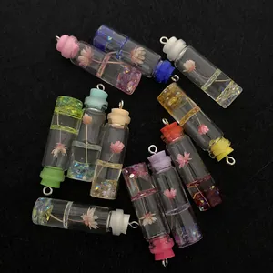 Mini glass bottle charms with dried flowers and resin decorations for DIY jewelry making
