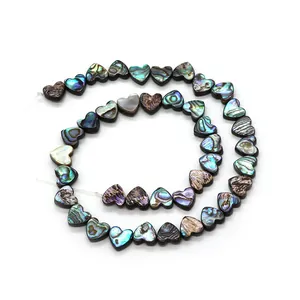 Natural heart-shaped abalone shell beads with iridescent blue-green hues for DIY jewelry