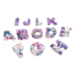 Handmade resin alphabet letters A-L with colorful crushed stones for DIY jewelry making