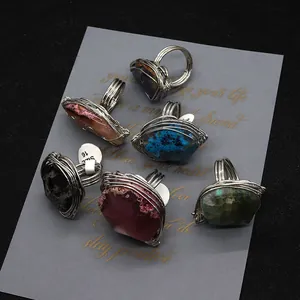 Set of six handmade wire wrapped natural stone rings in diverse colorful irregular shapes