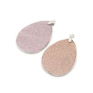 Natural teardrop shell pendants in purple and champagne with silver metal frames