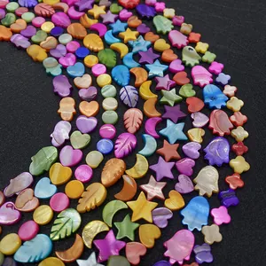 Macro shot of colorful shell beads in Hamsa and star shapes for DIY jewelry making