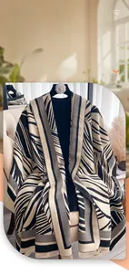 Close-up detail of soft zebra pattern shawl scarf with dense fringe tassels for winter warmth