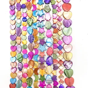 Rainbow shell beads in various shapes like heart, star, and moon for DIY jewelry making