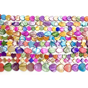 Colorful natural seashell beads in various shapes like heart and hamsa for DIY jewelry