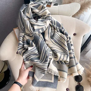 Thick grey and cream cashmere-feel scarf with geometric stripes and fringe tassels