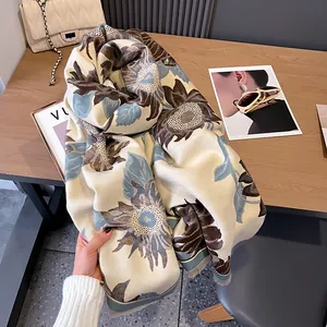 Detailed view of sunflower jacquard scarf with elegant long fringes on a wooden table