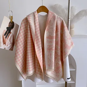 Pink and white houndstooth knit shawl with tassels and scenic landscape pattern