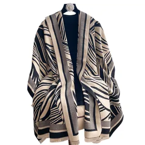 Elegant black and white zebra pattern knit shawl with tassels for autumn and winter