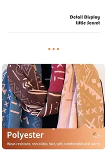 Detail of colorful geometric patterns on thick winter polyester pashmina scarf shawl