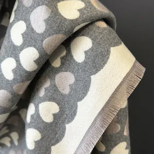 Gray cashmere-like shawl with heart jacquard pattern and soft fringe edges