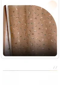 Close-up of butterfly print on warm brown cashmere-like winter scarf and shawl fabric