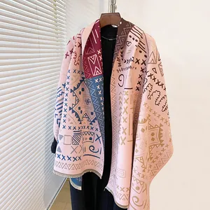 Thick cashmere-like pashmina shawl with ethnic geometric patterns and tassel edges