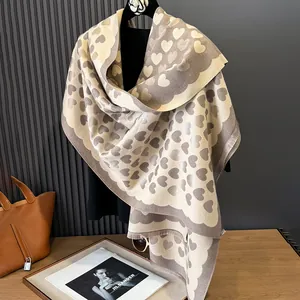 Close-up of thick heart-patterned cashmere-like shawl with delicate fringe edges