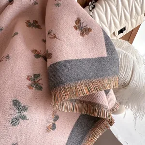 Winter butterfly print cashmere scarf in light pink with tassels and floral weave pattern