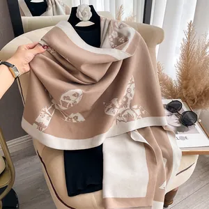 Elegant double-sided floral cashmere shawl in camel and cream colors for winter