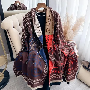 Detailed view of the ethnic pattern and tassel hem on this thick winter pashmina shawl
