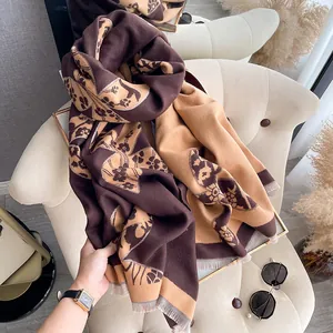 Detailed macro of thick reversible floral pashmina scarf with elegant fringe trim
