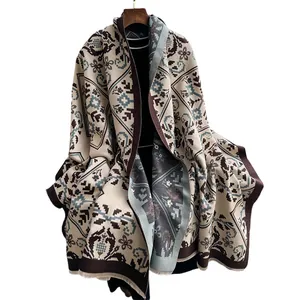 Ethnic style knitted shawl with geometric patterns and fringe in cream and blue