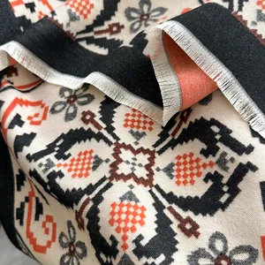 Ethnic style cashmere-like scarf with orange geometric patterns and delicate fringe