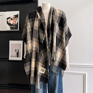 Thick plaid scarf with Good Luck patch and fringe in black, grey and yellow tones