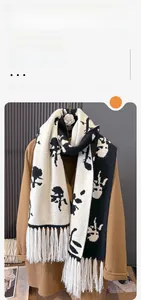 Detail of core-spun yarn scarf with fringe and abstract black and white floral print