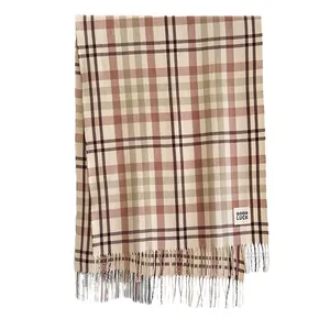 Plaid cashmere-like scarf with warm beige and brown tones and decorative tassels