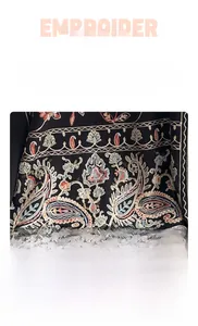 Detail of colorful paisley and floral embroidery on premium black cashmere pashmina